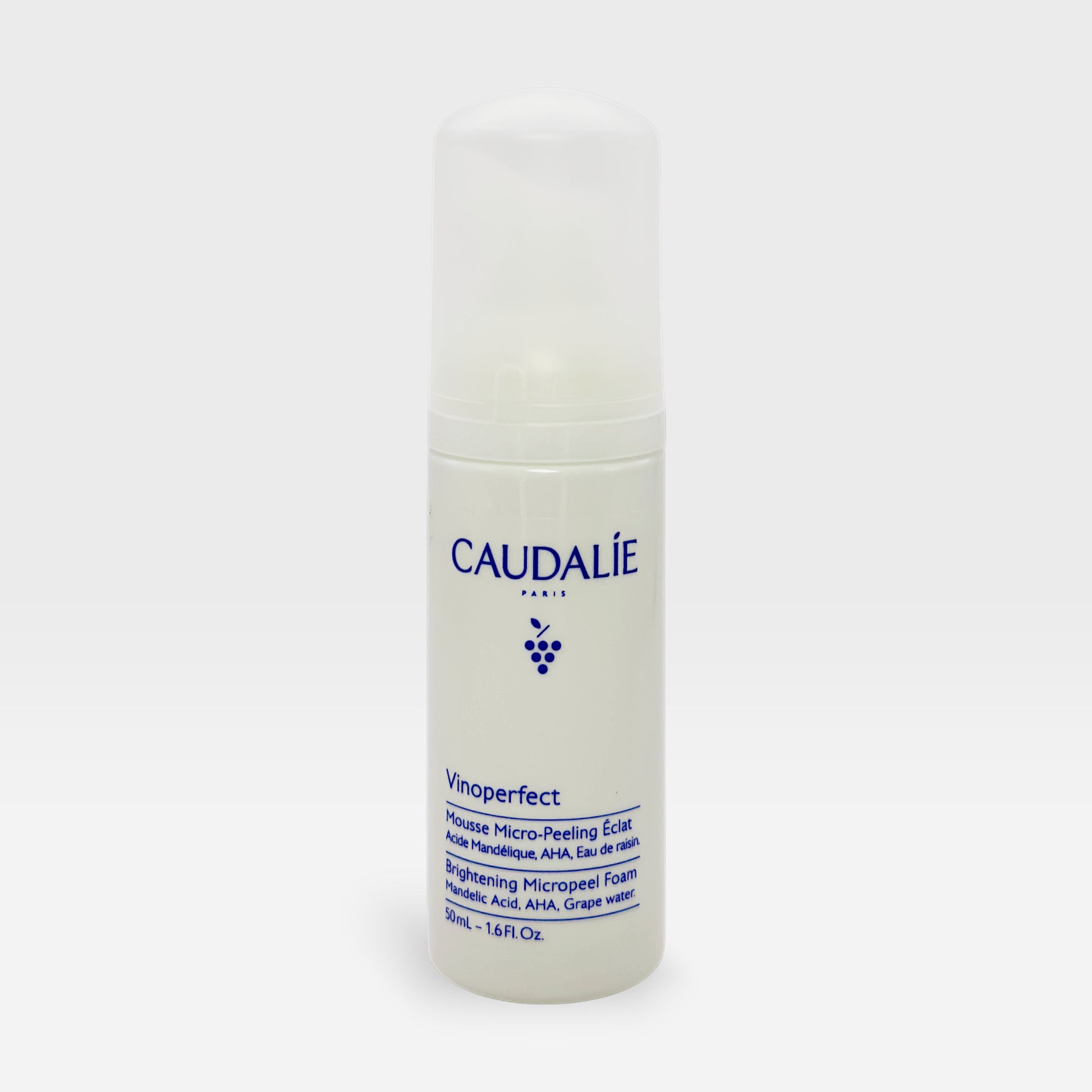 Caudalie Vinoperfect Micropeeling Mousse in a 100ml bottle, a gentle exfoliating mask for radiant skin, shown in a sleek container.