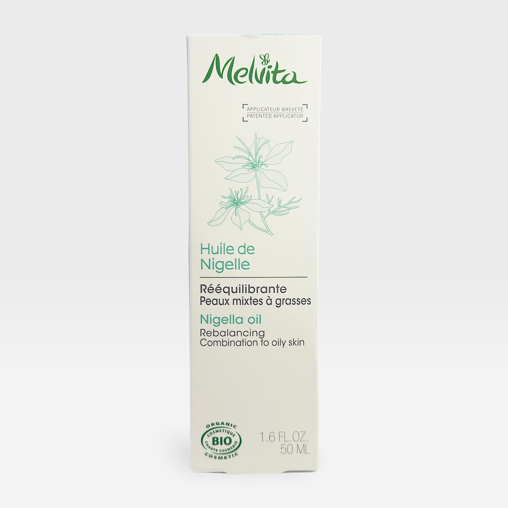 Melvita Organic Nigella Oil in a 50ml fluid bottle, showcasing the dark glass container with the oil inside.