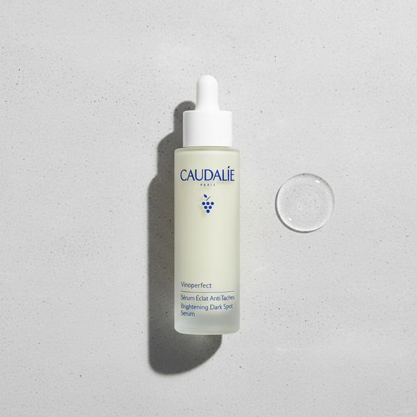 Caudalie Vinoperfect Radiance Serum bottle with a sleek 50ml design, featuring a pump dispenser and clean branding.